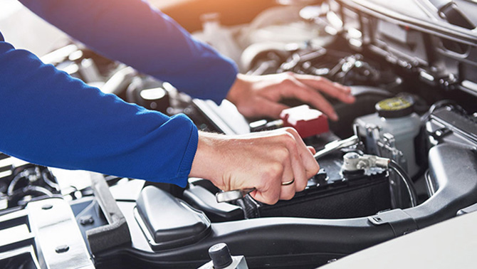 our mechanics performing car repairs and maintenance services